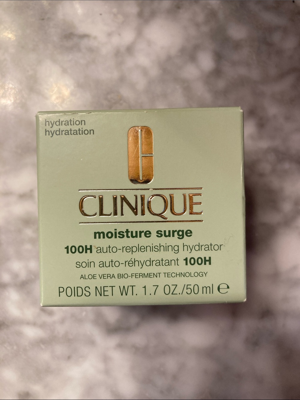 Clinique Moisture Surge Hydrator in Mint Green with Gold Logo